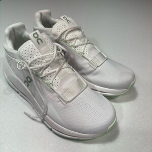 On Running White Sneakers with Green Accents